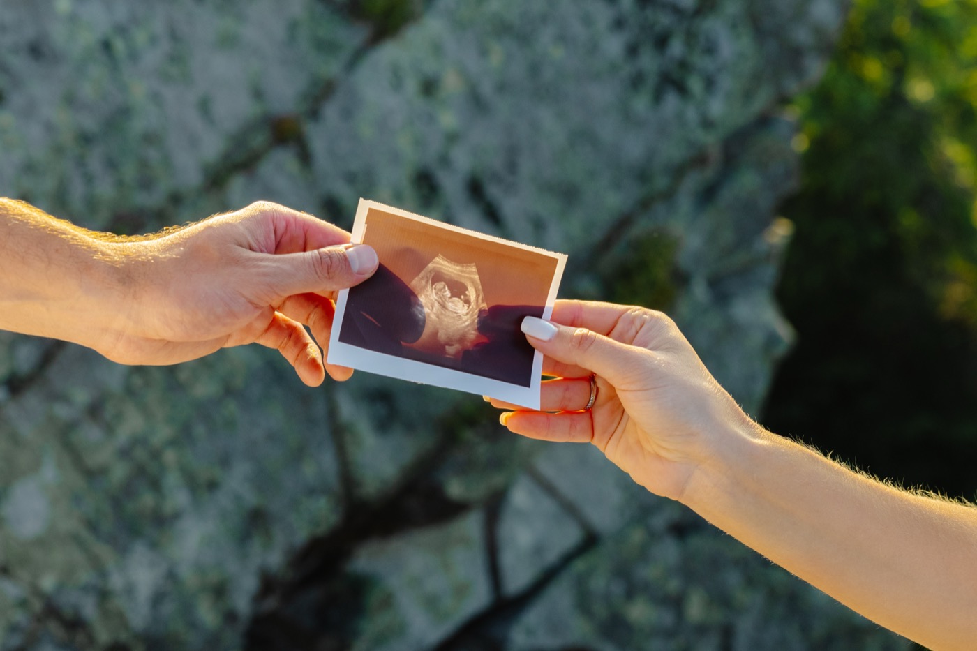 Couple holding their baby ultrasound scan from Western Australia elective session